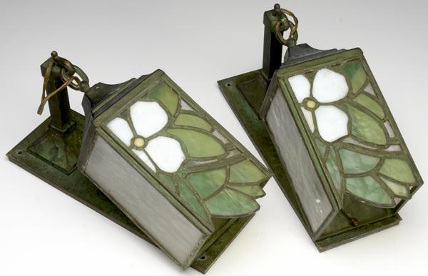 Appraisal: ARTS CRAFTS LIGHTING Pair of wall-mounted hanging lanterns with floral