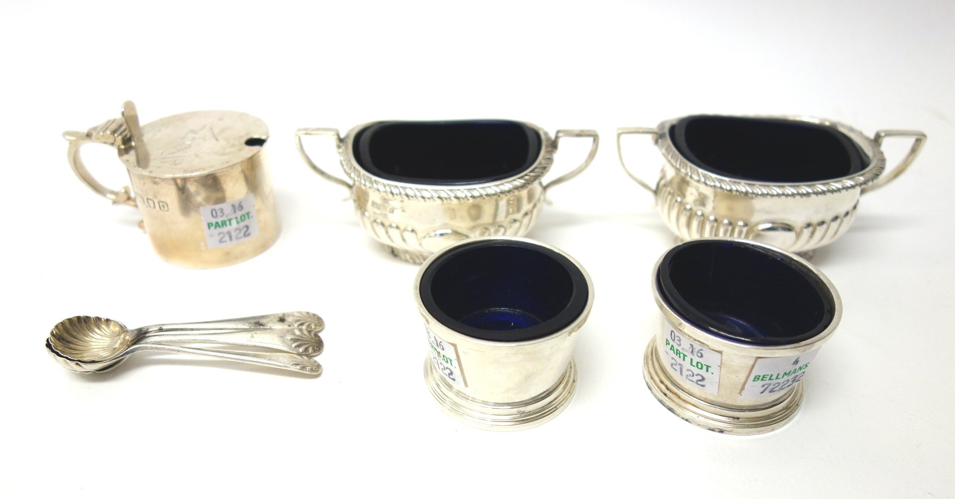 Appraisal: Silver condiments comprising two similar twin handled boat shaped salts