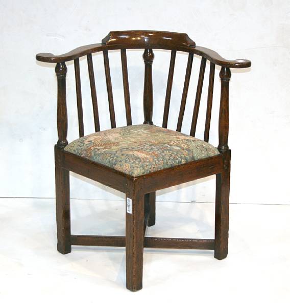 Appraisal: A George III oak corner armchair mid th century height