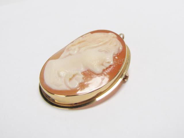 Appraisal: K yellow gold mounted Italian seashell cameo pin pendant depicting