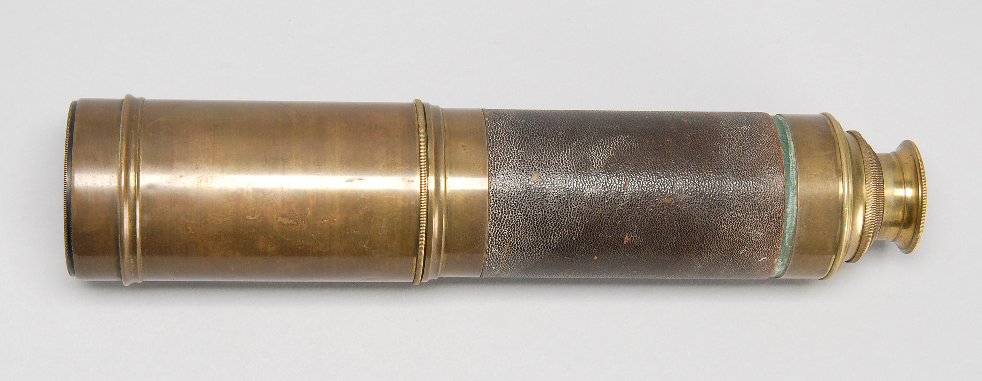 Appraisal: FOUR-DRAW BRASS TELESCOPE th CenturyPartially wrapped in leather Length extended