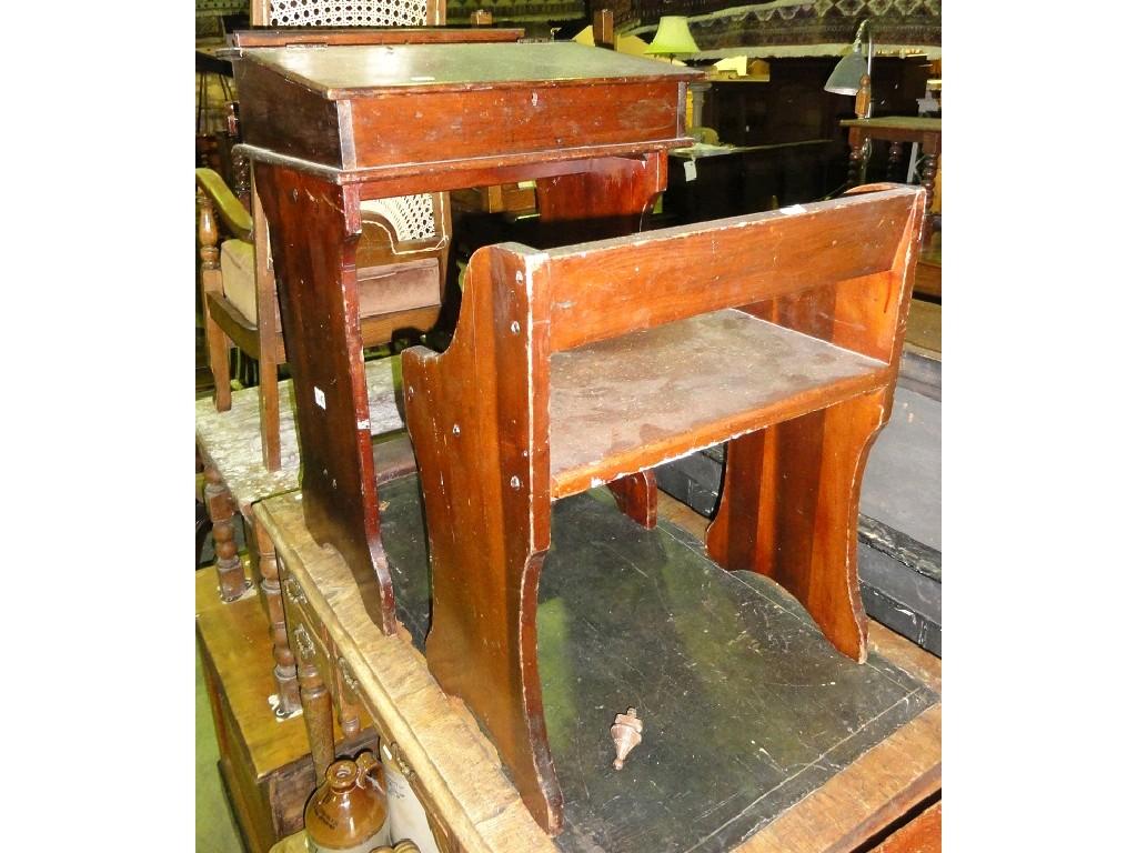 Appraisal: A child's stained walnut school desk and matching chair