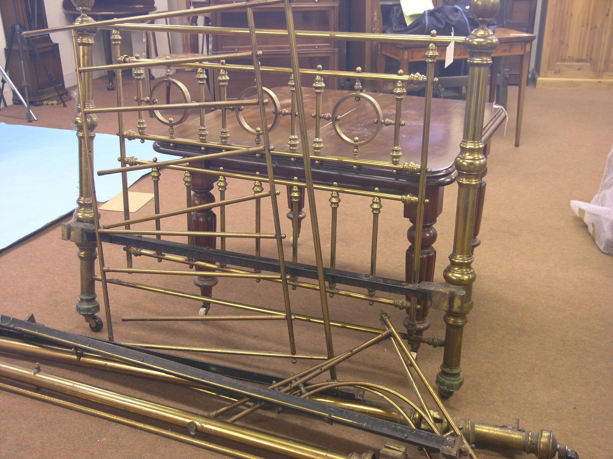 Appraisal: A Victorian brass bedstead with ornamental tubular brass headboard ft