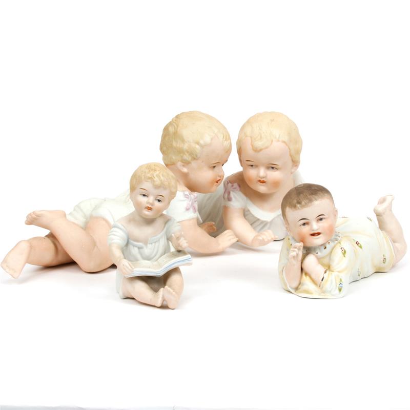 Appraisal: Group of four German bisque piano babies Largest H x