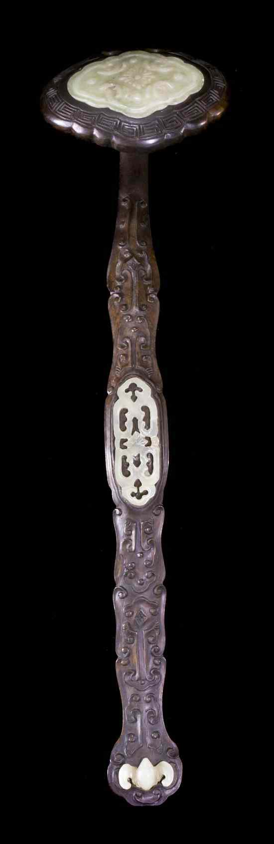 Appraisal: A Jade Inset Hardwood Ruyi Scepter having a relief carved