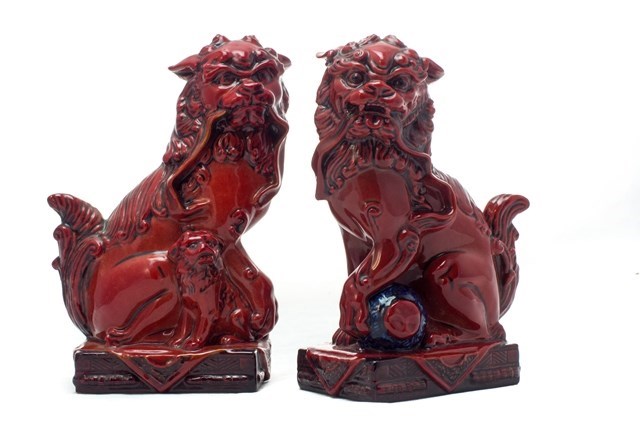 Appraisal: A pair of Royal Doulton flambe Qinghai Fu Dogs Ltd