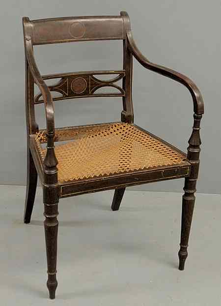 Appraisal: Regency open armchair with paint decoration and caned seat As