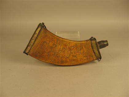 Appraisal: th century style powder horn Brass mounted with carved decoration