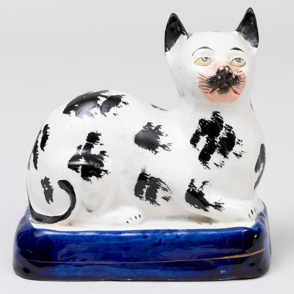 Appraisal: Staffordshire Creamware Model of Recumbent Cat in high D M