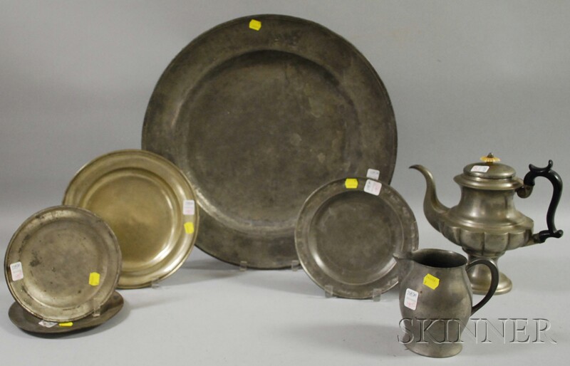 Appraisal: Seven Pieces of Pewter Tableware a footed teapot large charger