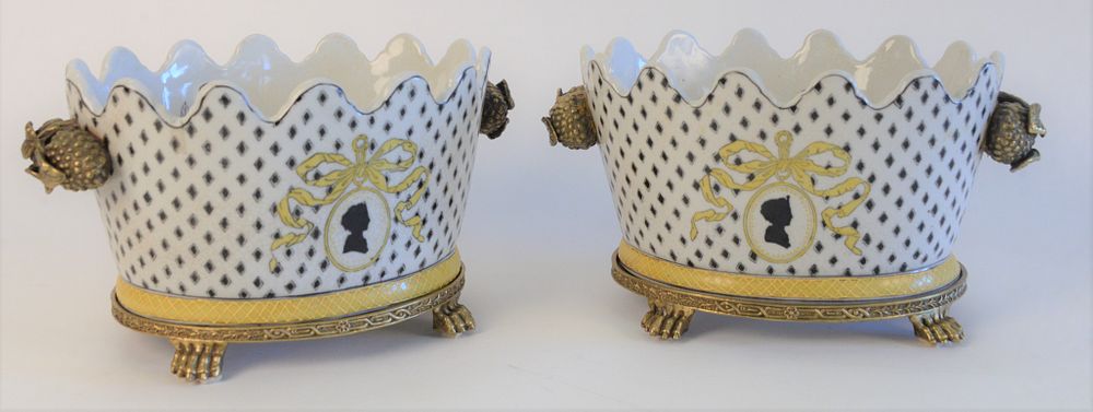 Appraisal: Pair of Porcelain Cachepots with painted and enamel decoration on