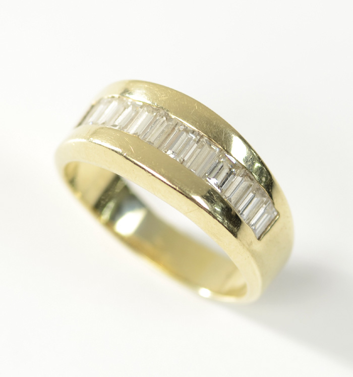 Appraisal: MAN'S DIAMOND AND FOURTEEN KARAT GOLD RING The wedding band