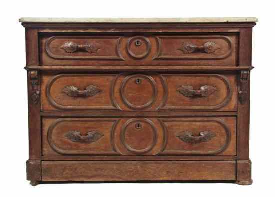 Appraisal: A Victorian Walnut Chest of Drawers with a rectangular white