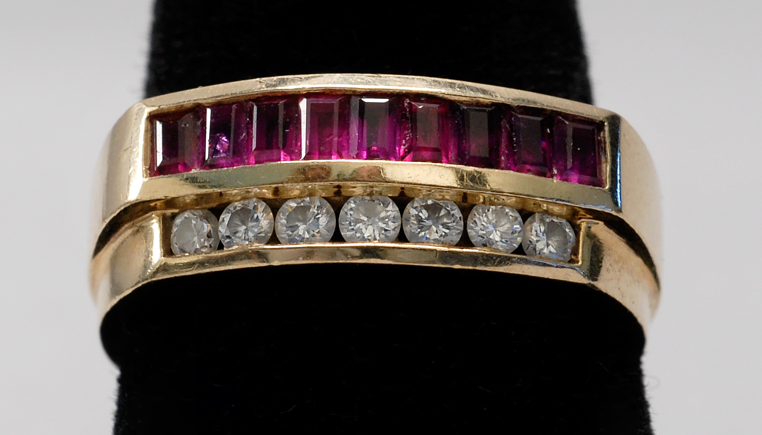 Appraisal: KT YELLOW GOLD RUBY AND DIAMOND RING with flanking rows