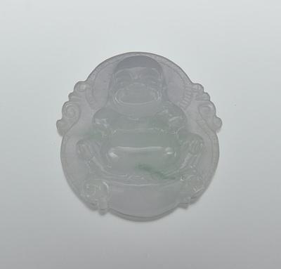 Appraisal: A Carved Jadeite Buddha Pendant Carved out of pale lavender