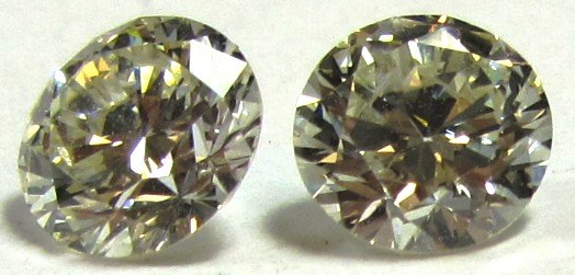 Appraisal: Two unmounted circular cut diamonds estimated total weight cts