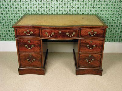 Appraisal: A late George III mahogany serpentine front pedestal desk the