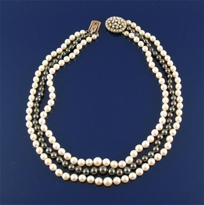 Appraisal: A three row cultured pearl necklace With two white strands