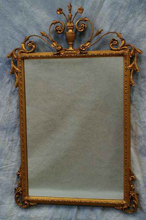 Appraisal: Rectangular gilt wall mirror with urn crest th c x