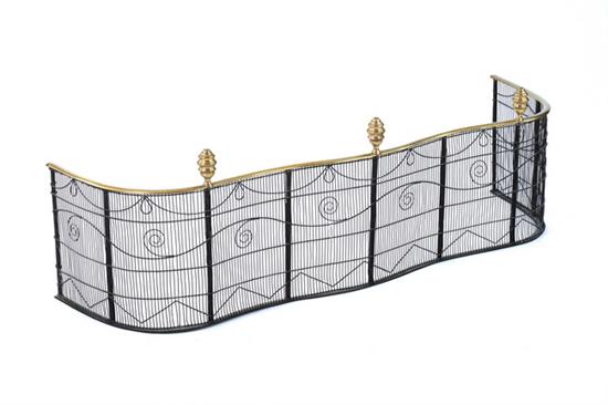 Appraisal: REGENCY BRASS AND EBONIZED WOVEN MESH SERPENTINE FIRE FENDER th