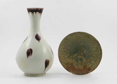 Appraisal: A white glazed pear-shaped vase with a spreading neck decorated