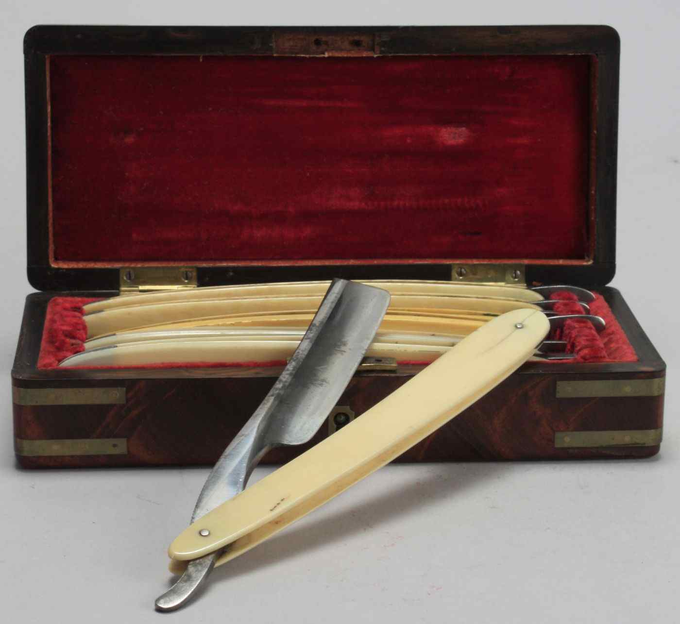 Appraisal: BOXED SET OF SEVEN STRAIGHT-EDGE RAZORS th CenturyBrass-bound box in