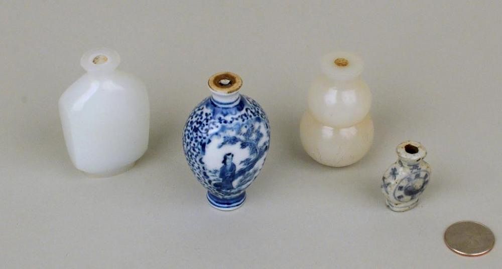 Appraisal: Four Chinese Glass Porcelain Snuff Bottles Four Chinese glass and