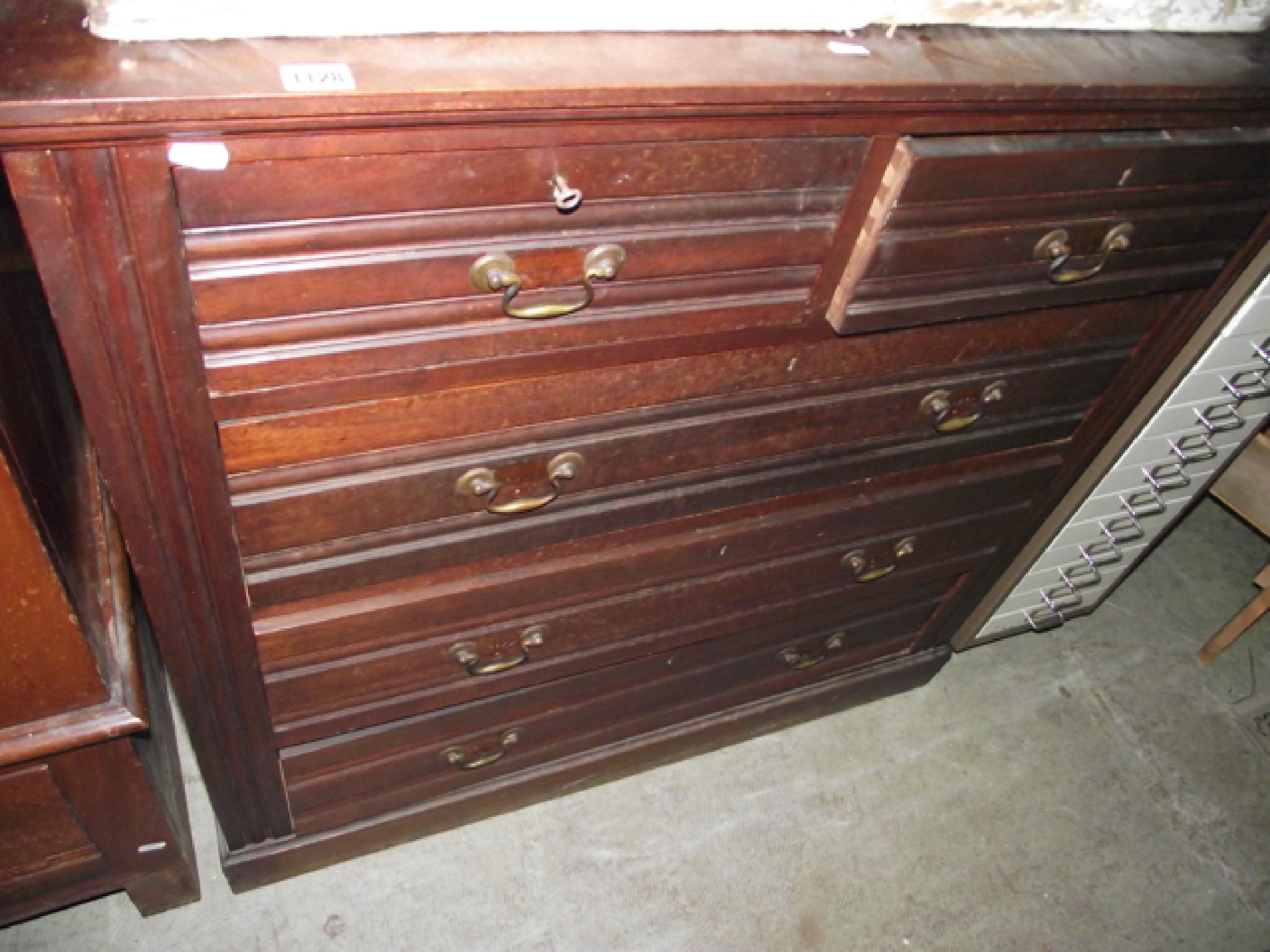 Appraisal: An Edwardian bedroom chest of three long and two short