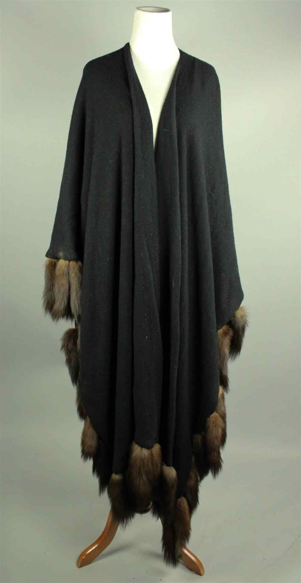 Appraisal: ADRIENNE LANDAU BLACK WOOL CAPE WITH SABLE TAIL TRIM the