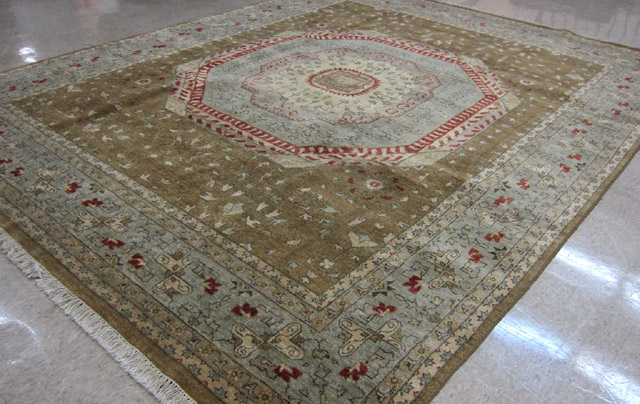 Appraisal: HAND KNOTTED ORIENTAL CARPET Indo-Persian stylized floral and large central