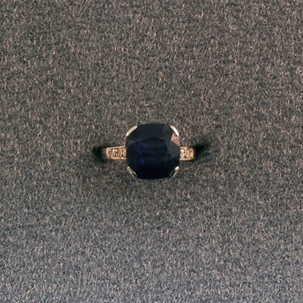 Appraisal: kt White Gold and Blue Gemstone Ring the cushion-cut stone