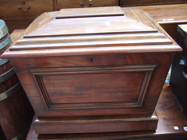 Appraisal: A George III mahogany sarcophagus form cellarette raised on a