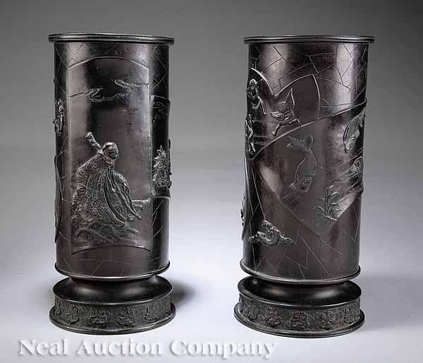 Appraisal: A Companion Pair of Antique Japanese Relief-Decorated Bronze Vases c