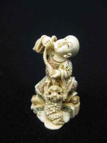 Appraisal: Carved Ivory Netsuke of Child Toad fancy polychrome signed ''