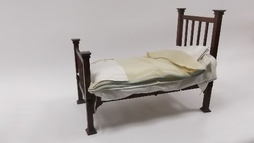 Appraisal: A dolls' ft railback bedstead complete with horsehair mattress and