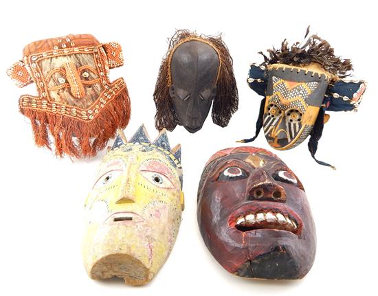 Appraisal: TRIBAL Five carved African masks two Kuba tribe headdresses the