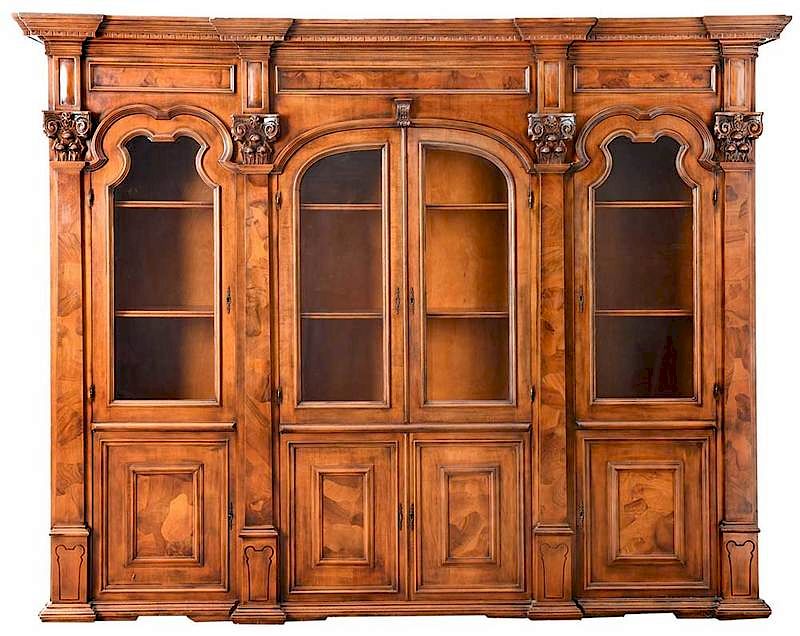 Appraisal: Neoclassical Style Bookcase th century three sections with upper molding