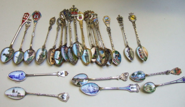 Appraisal: A collection of twenty three enamelled town crest souvenir spoons