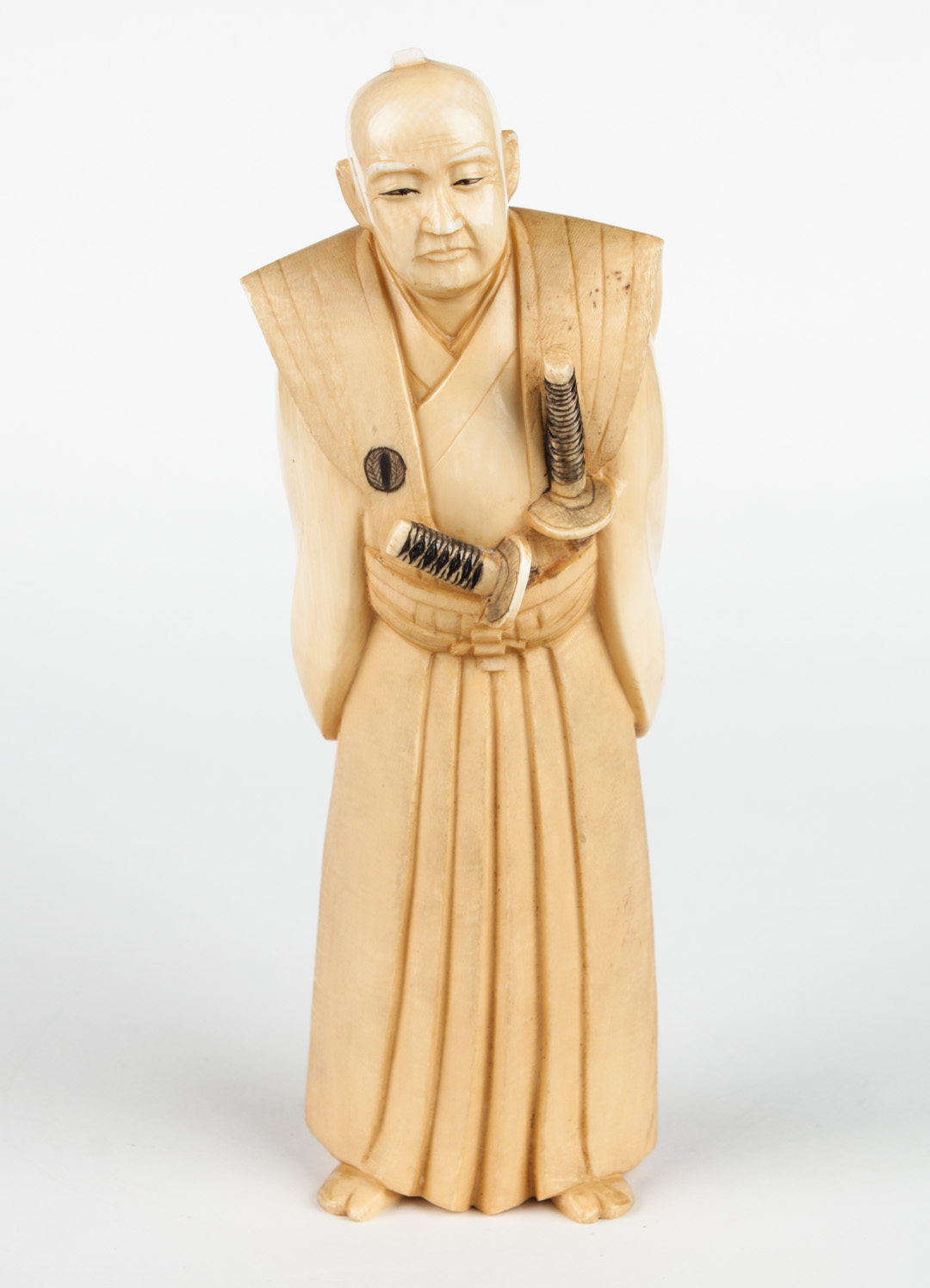 Appraisal: Japanese caved ivory samurai warrior carved and ink highlighted figure