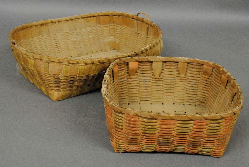 Appraisal: - Two splintwood gathering baskets largest with stencil decoration h