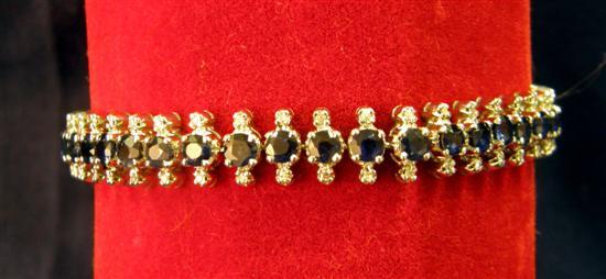 Appraisal: Diamond and sapphire set articulated bracelet in white gold