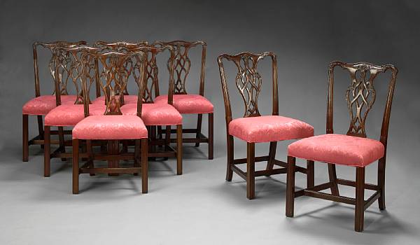 Appraisal: A set of sixteen George III style carved mahogany dining