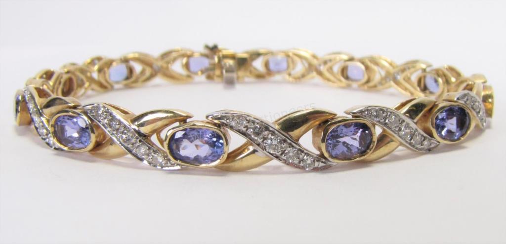 Appraisal: A K white and yellow gold bezel set bracelet with