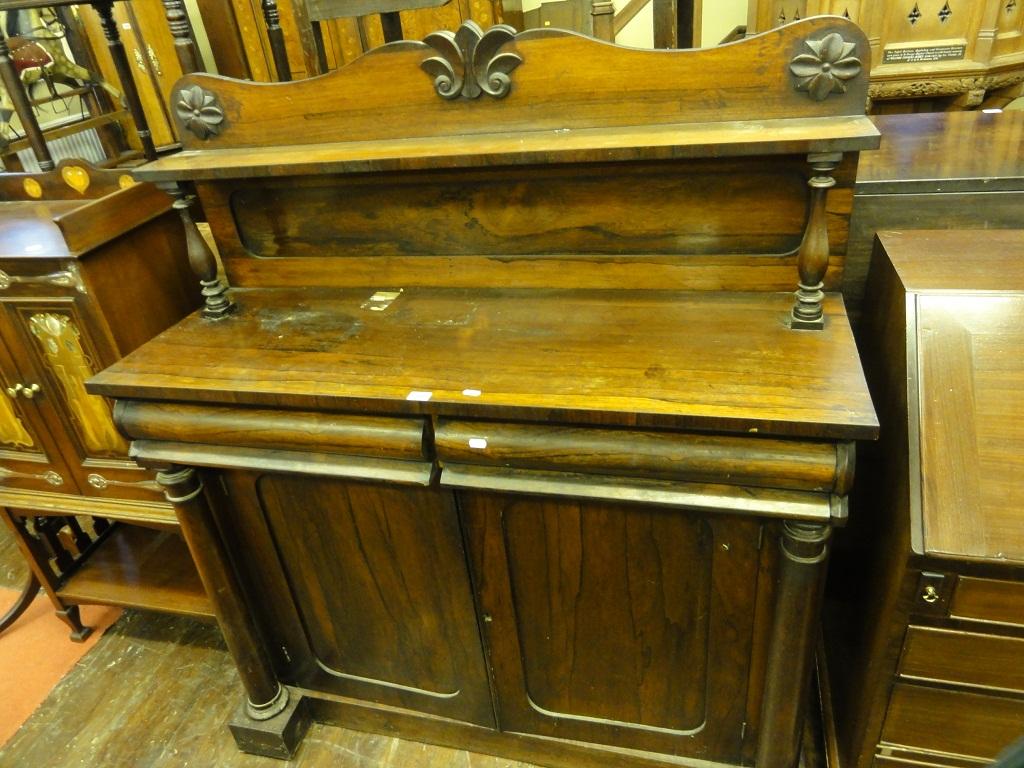 Appraisal: A Victorian rosewood chiffonier the raised panelled back with shaped