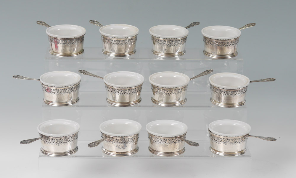 Appraisal: WHITING STERLING RETICULATED RAMEKIN HOLDERS Pierced floral motif rims and