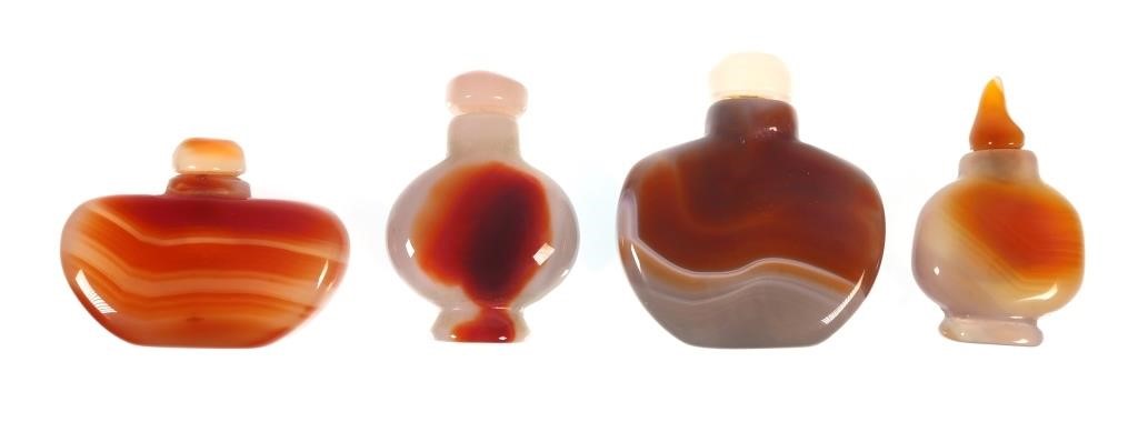 Appraisal: These four snuff bottles are carved out of highly polished