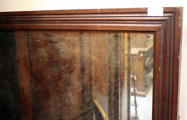 Appraisal: A LARGE WALL MIRROR with moulded dark stained hardwood frame