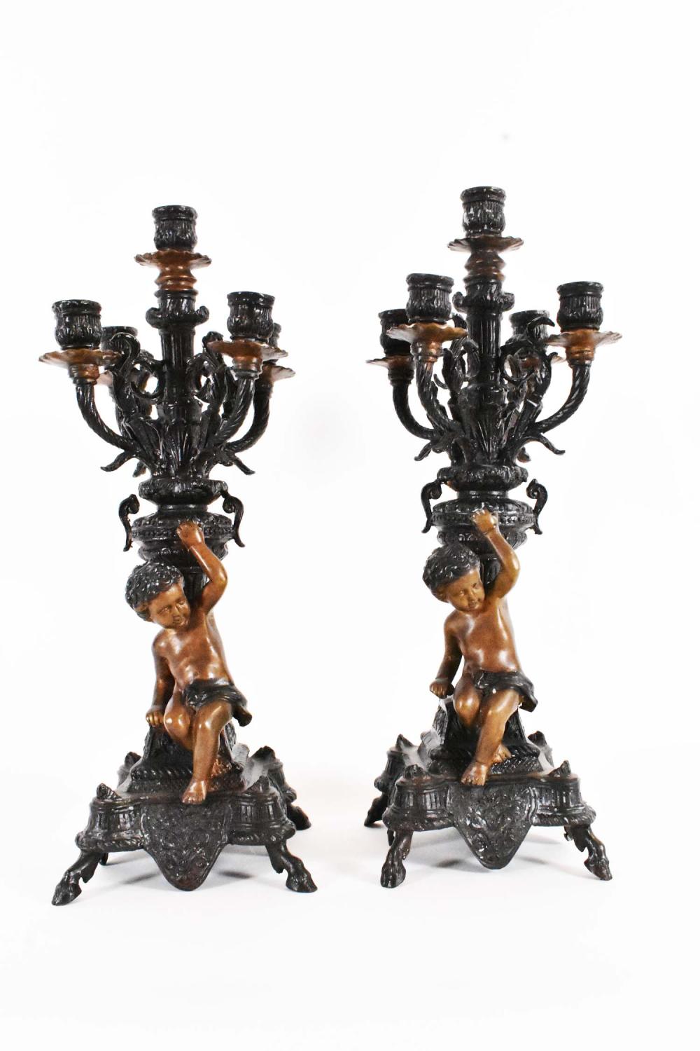 Appraisal: PAIR OF PATINATED METAL FIVE LIGHT CANDELABRAIn the Renaissance style