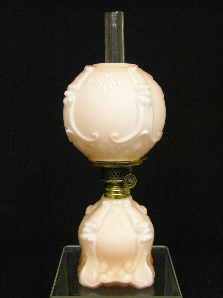 Appraisal: PEACH SATIN GLASS MINIATURE OIL LAMP wick knob marked Nutmeg