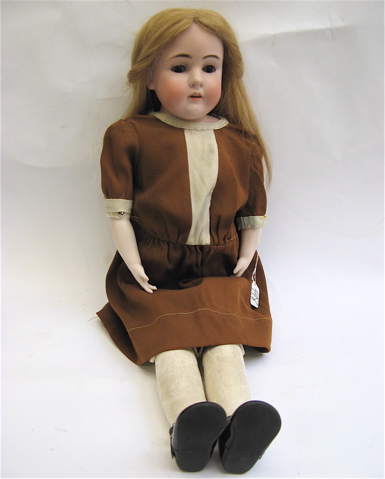 Appraisal: BISQUE HEAD GIRL DOLL inches ht long golden brown hair